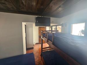 Un pat sau paturi într-o cameră la Hotel Pura Vida