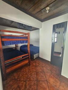 Un pat sau paturi într-o cameră la Hotel Pura Vida