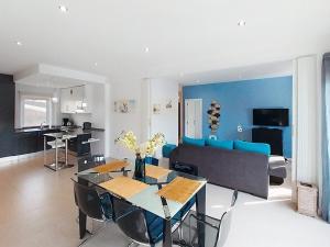 a living room with a table and a couch at Panorama Old Town sea view Albufeira in Albufeira