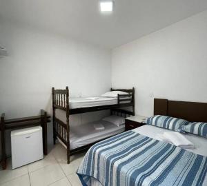 Ένα ή περισσότερα κρεβάτια σε δωμάτιο στο Pousada Caravela +4 φωτογραφίες