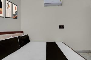 Postel nebo postele na pokoji v ubytování Hotel O Prince