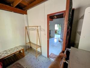 a person holding a ladder in a room at HyperLuˢᵖᵃᶜᵉ in Ko Kood