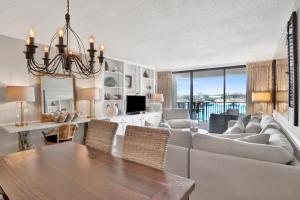 a living room with a couch and a table at Wind Drift 313N in Orange Beach