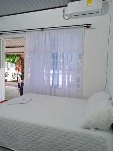 Giường trong phòng chung tại Habitación Hilmar