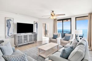 a living room with a flat screen tv at Phoenix X 1201 in Perdido Key