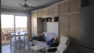 a living room with a couch and a table at Relax Beach in Benalmádena