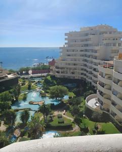 an aerial view of a resort with a river and buildings at Relax Beach in Benalmádena