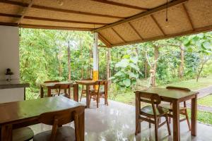 a group of tables and chairs on a patio at Pristine penida in Nusa Penida