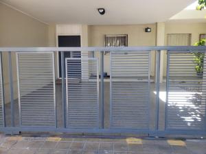 a metal gate in front of a building at Shanti Loft B in San Juan