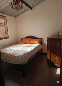 Ένα ή περισσότερα κρεβάτια σε δωμάτιο στο Casa El Trapiche de Mindo
