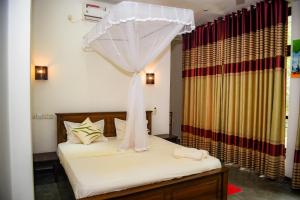 Una cama o camas en una habitación de Sunworld Villa