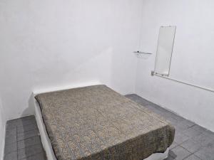 Ένα ή περισσότερα κρεβάτια σε δωμάτιο στο Sua estadia pé na areia - Só atravessar a Rua +17 φωτογραφίες