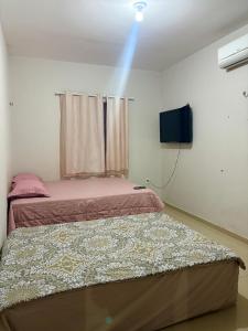Ένα ή περισσότερα κρεβάτια σε δωμάτιο στο Temporada AK Freitas