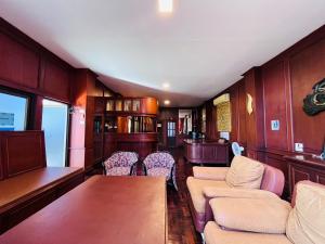 a train car with a table and chairs in it at Lanna Boutique Resort Chiang Mai in Chiang Mai