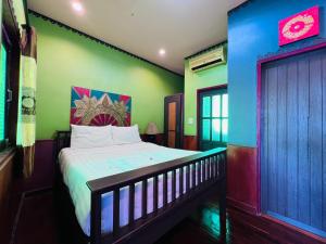 a bedroom with a bed in a room at Lanna Boutique Resort Chiang Mai in Chiang Mai