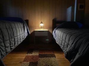 Ένα ή περισσότερα κρεβάτια σε δωμάτιο στο Cabaña Vista Bosque