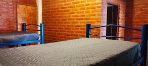 Ένα ή περισσότερα κρεβάτια σε δωμάτιο στο Habitación Compartida Tipo Hostel para los más aventureros