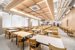 an empty dining room with tables and chairs at Ocean2YouResort SokchoSeorakBeach Hotel&Condo in Sokcho