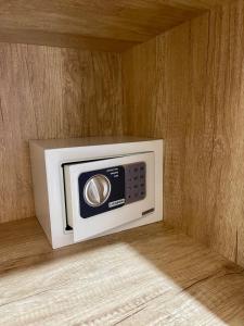 a microwave in the corner of a wall at Peaceful Tropical Villa with private pool in Panji
