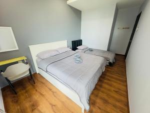 Ένα ή περισσότερα κρεβάτια σε δωμάτιο στο Chloe Homestay, Jazz Suites 1, Vivacity Megamall