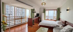 Ένα ή περισσότερα κρεβάτια σε δωμάτιο στο Chongqing Justom Family Serviced Apartments 1 +106 φωτογραφίες