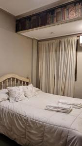 Ένα ή περισσότερα κρεβάτια σε δωμάτιο στο Apartamento San Lorenzo