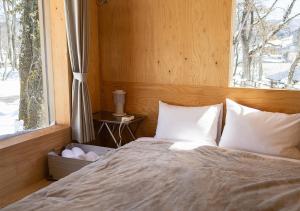 Ένα ή περισσότερα κρεβάτια σε δωμάτιο στο Snow Peak LAND STATION HAKUBA - Vacation STAY 12869v