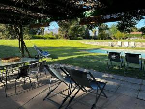 a group of chairs and a table in a park at Lodge Boutique Casa Cardonal in Paine