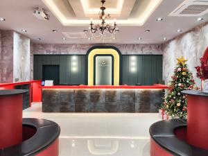 a christmas tree in the lobby of a hotel at Paramion Hotel in Busan