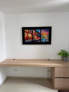 Μια τηλεόραση ή/και κέντρο ψυχαγωγίας στο Moderno apartamento amoblado 2 habitaciones +5 φωτογραφίες