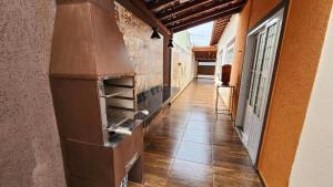 an empty hallway of a building with a stove at Pousada da Lua Barretos in Barretos
