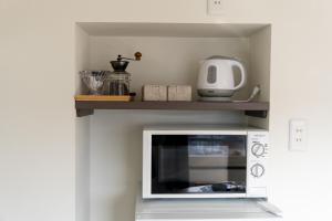 Η κουζίνα ή μικρή κουζίνα στο Toya Tiny Cabin 洞爺タイニーキャビン +10 φωτογραφίες