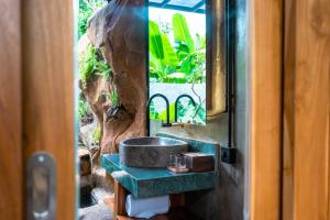 a bathroom with a sink and a mirror at Peaceful 1BR Private Villa in Sayan Ubud in Ubud +38 photos