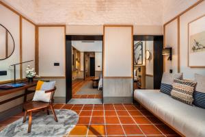 a living room with a couch and a table at Cheong Fatt Tze - The Qing Suites in George Town