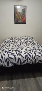 Ένα ή περισσότερα κρεβάτια σε δωμάτιο στο Chez Thierry et Alexandra