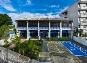 an exterior view of a building with a swimming pool at Cheong Fatt Tze - The Qing Suites in George Town