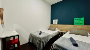 Ένα ή περισσότερα κρεβάτια σε δωμάτιο στο Loft Waterfront Kuching +6 φωτογραφίες