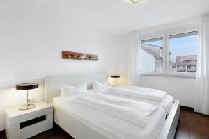 Ένα ή περισσότερα κρεβάτια σε δωμάτιο στο Markgraf Apartments Haus 4