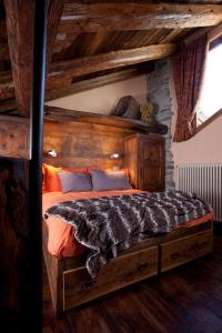 Ένα ή περισσότερα κρεβάτια σε δωμάτιο στο Il Fienile Della Nonna Introd