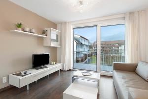 Μια τηλεόραση ή/και κέντρο ψυχαγωγίας στο Markgraf Apartments Haus 4