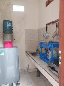 a kitchen with a sink and a counter with a mixer at Sintya Homestay in Ubud +27 photos