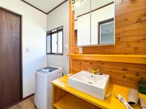 a bathroom with a sink and a washer at #43 Sajima nagi in Yokosuka