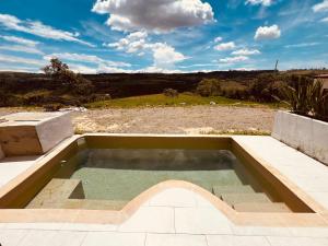 a small pool of water in a patio at Majestic View House in Curití
