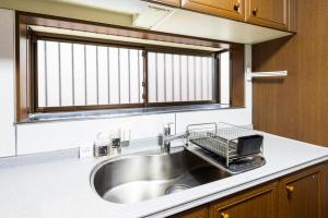 Kuchyň nebo kuchyňský kout v ubytování 桜堂 S-Mark INN + 42 fotografií