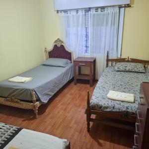 Ένα ή περισσότερα κρεβάτια σε δωμάτιο στο El sueño de papá