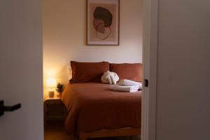 Ένα ή περισσότερα κρεβάτια σε δωμάτιο στο Vineyard Villa