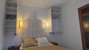 Ένα ή περισσότερα κρεβάτια σε δωμάτιο στο Studio Koton - 3 étoiles - Deshaies centre