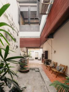 an internal courtyard of a house with a living room at Cheong Fatt Tze - The Townhouses in George Town