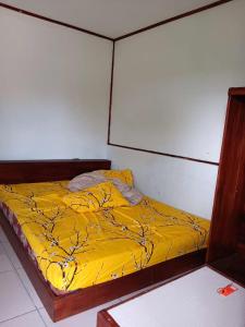 Ένα ή περισσότερα κρεβάτια σε δωμάτιο στο Mangrove Dive