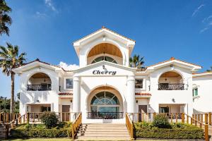 a white building with a cheery sign on it at Stay Cherry in Namwon